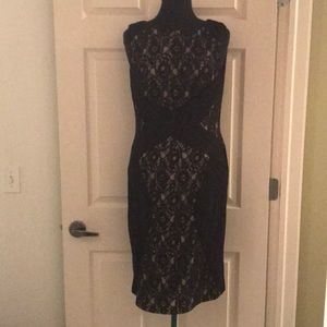 Beautiful lace dress black with tan underline.